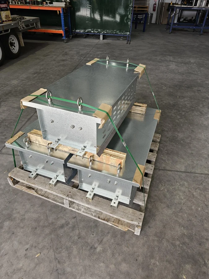 Completed braking resistor enclosures secured on a pallet at the Brisbane factory